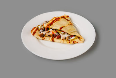Close-up of food in plate on white background