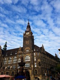 Low angle view of historic building against cloudy sky