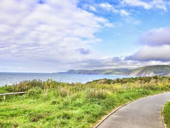 Scenic view of landscape against cloudy sky