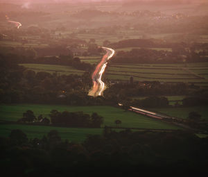 Scenic view of field against sky at night