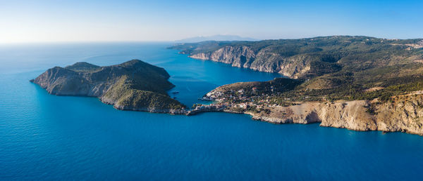 High angle view of sea and rocks against sky