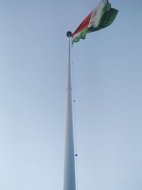 Low angle view of flag against clear sky