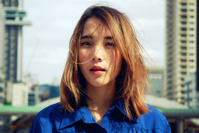 Portrait of beautiful woman with tousled hair