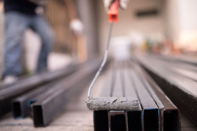 Close-up of railroad station platform