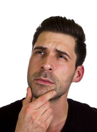 Close-up portrait of young man over white background