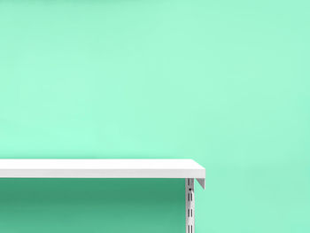 High angle view of white table against blue background