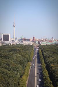 View of buildings in city against clear sky