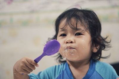 Portrait of cute boy eating ice cream