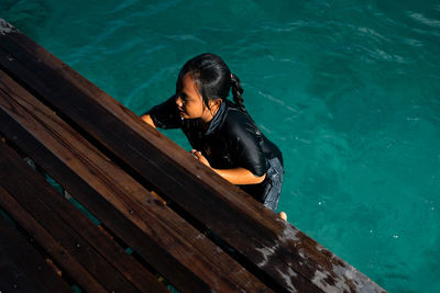 High angle view of man swimming in sea