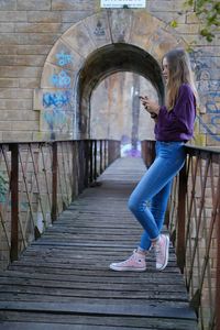 Side view of woman in corridor of building