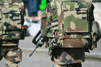 Midsection of soldiers wearing camouflage clothing