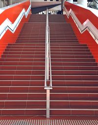 Low angle view of red steps leading towards building