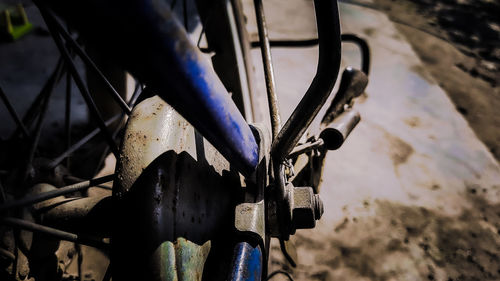 Close-up of bicycle wheel on field