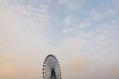 Low angle view of ferris wheel against sky