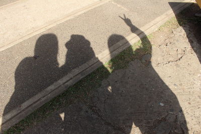 Shadow of people on street