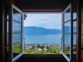 Scenic view of mountains seen through window