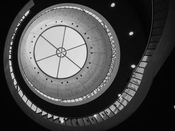 Low angle view of spiral staircase against skylight