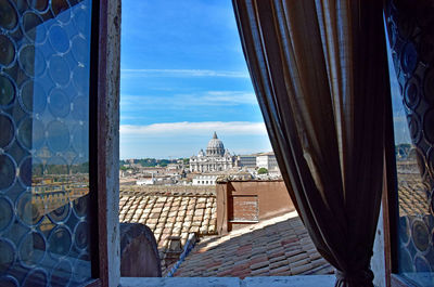 View of buildings seen through window