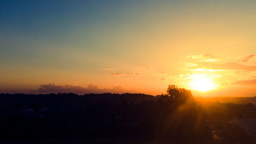 Scenic view of silhouette landscape against sky during sunset