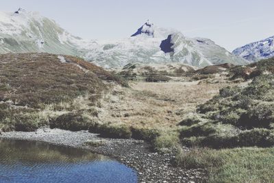 Scenic view of snowcapped mountains against sky