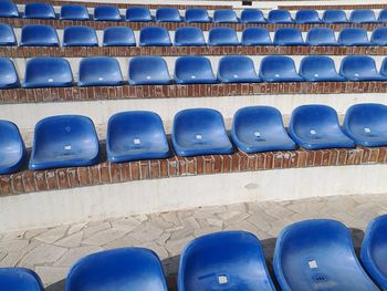 Full frame shot of blue bleachers at stadium