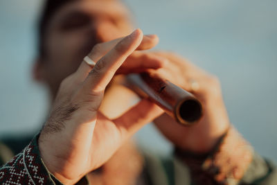 Cropped hand of man using mobile phone