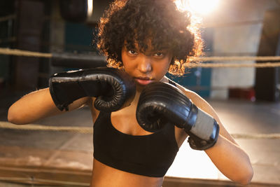 Young woman exercising in gym