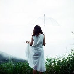 Woman standing on field