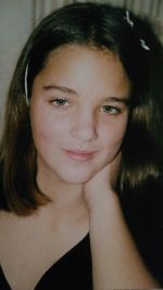 Close-up portrait of smiling young woman