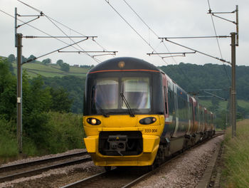 Train on railroad track against sky