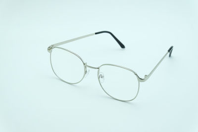 Close-up of eyeglasses against white background