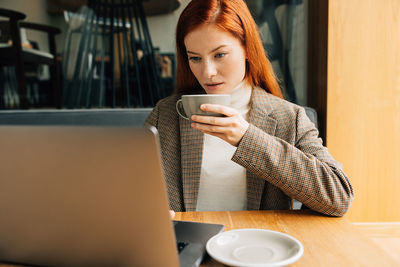 Young woman using mobile phone