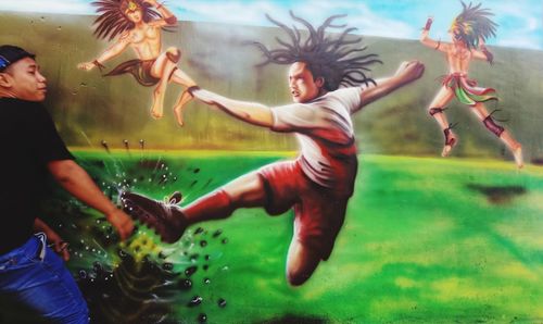 Group of people dancing in water