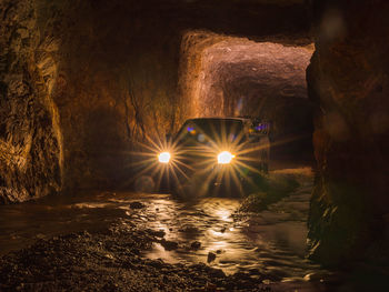 Illuminated lighting equipment on rock at night