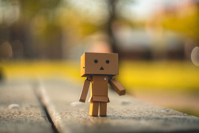 Close-up of wooden toy on footpath