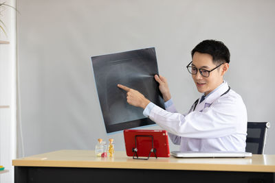 Young man using laptop on table