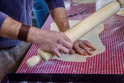 High angle view of man preparing food on table