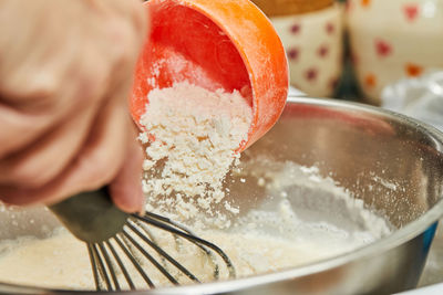 Knead the dough in bowl and add flour to it