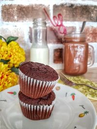 Close-up of muffins in plate on table