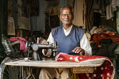 Portrait of man working on table