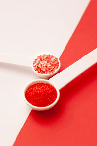 High angle view of strawberries on table against white background