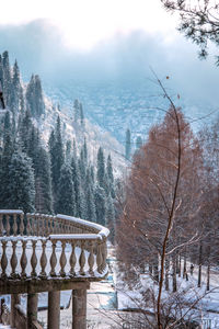 Scenic view of frozen mountains against sky during winter