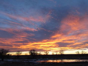Scenic view of landscape against cloudy sky