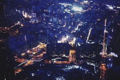 Aerial view of illuminated city at night