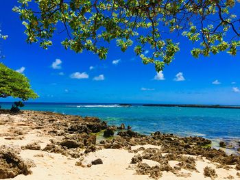 Scenic view of sea against blue sky