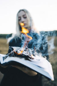 Portrait of young woman using mobile phone