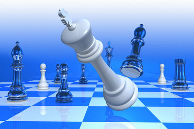 Digital composite image of chess against colored background