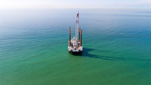 High angle view of ship in sea against sky