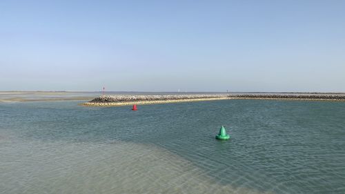 Scenic view of sea against clear sky