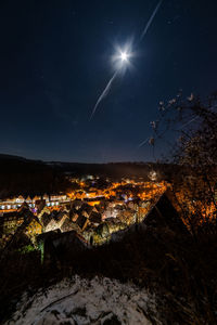 Scenic view of illuminated city against sky at night